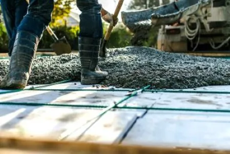 workers spreading cement